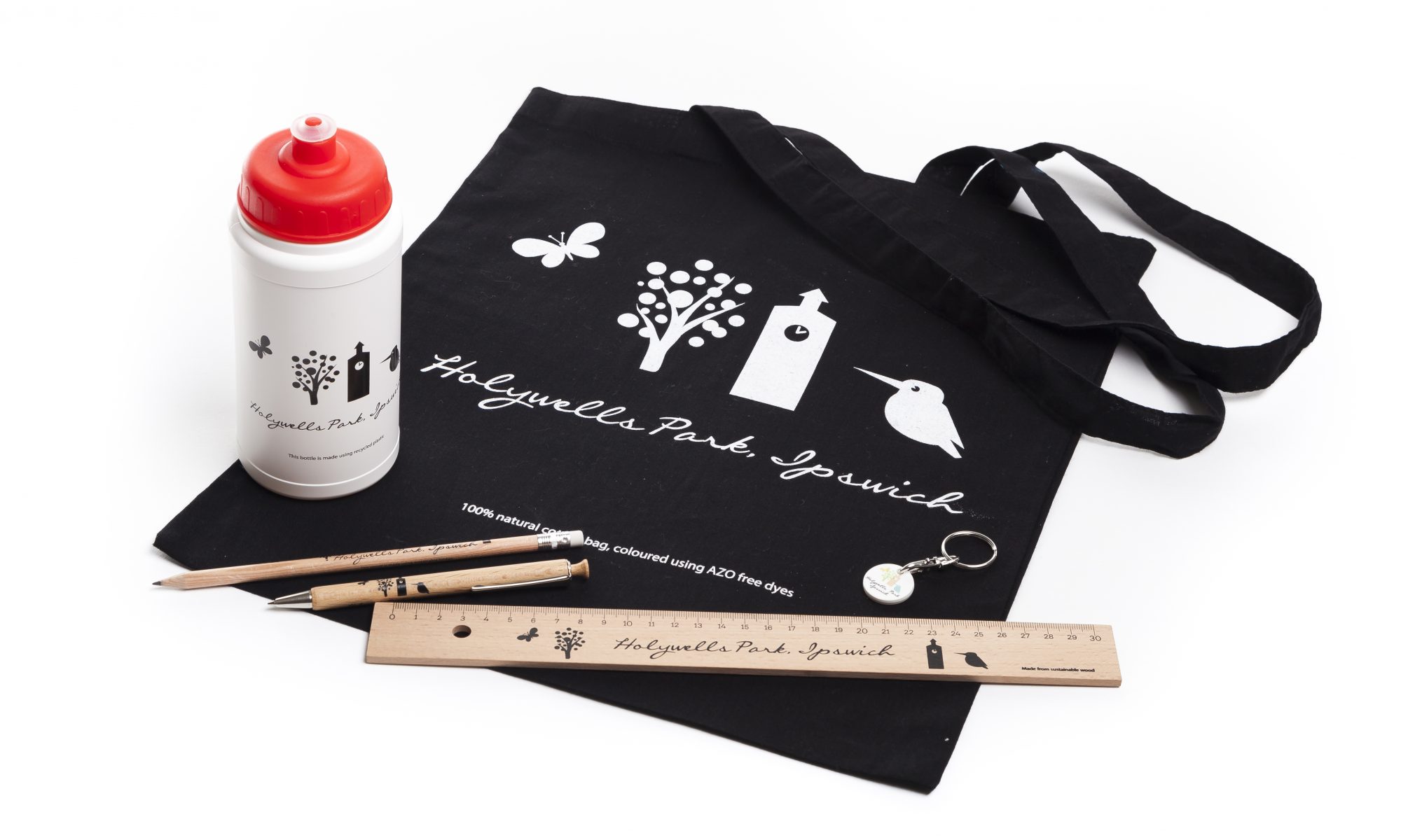 A bag, bottle, wooden pen, pencil and ruler